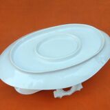 Sauce boat on dormant white porcelain, floral decoration