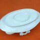 Sauce boat on dormant white porcelain, floral decoration