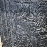 huge old fireplace plate has decoration of angels, crown and fleurs-de-lis
