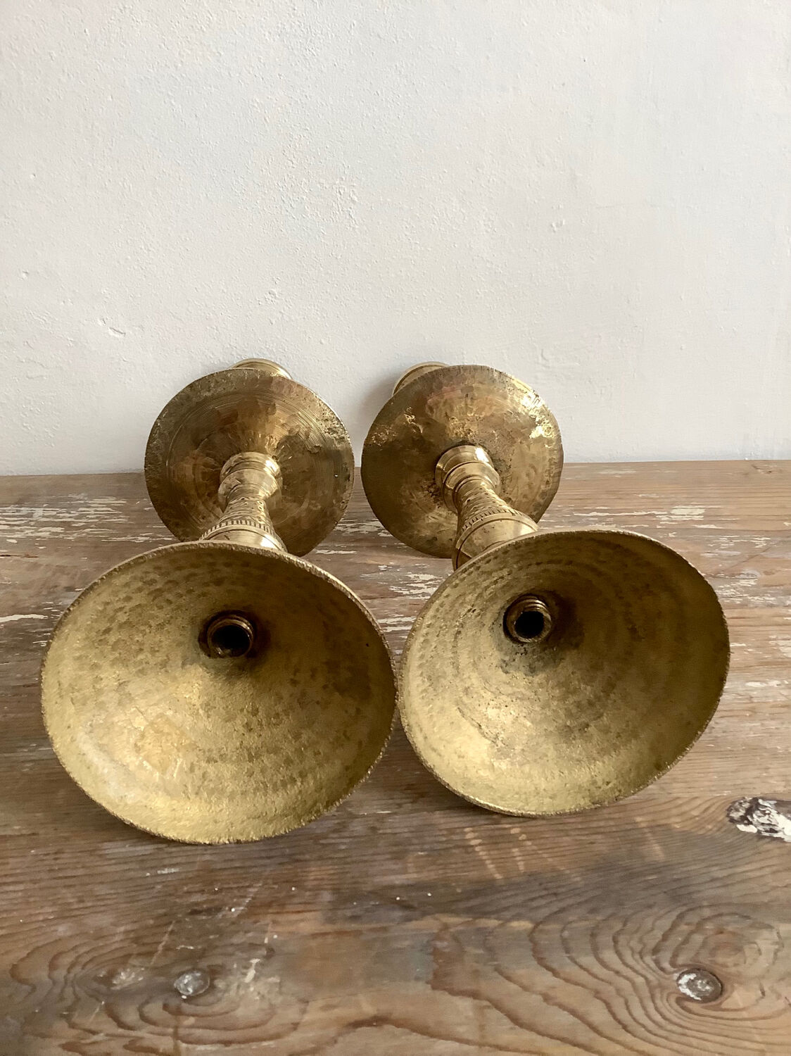Pair of engraved brass candle holders