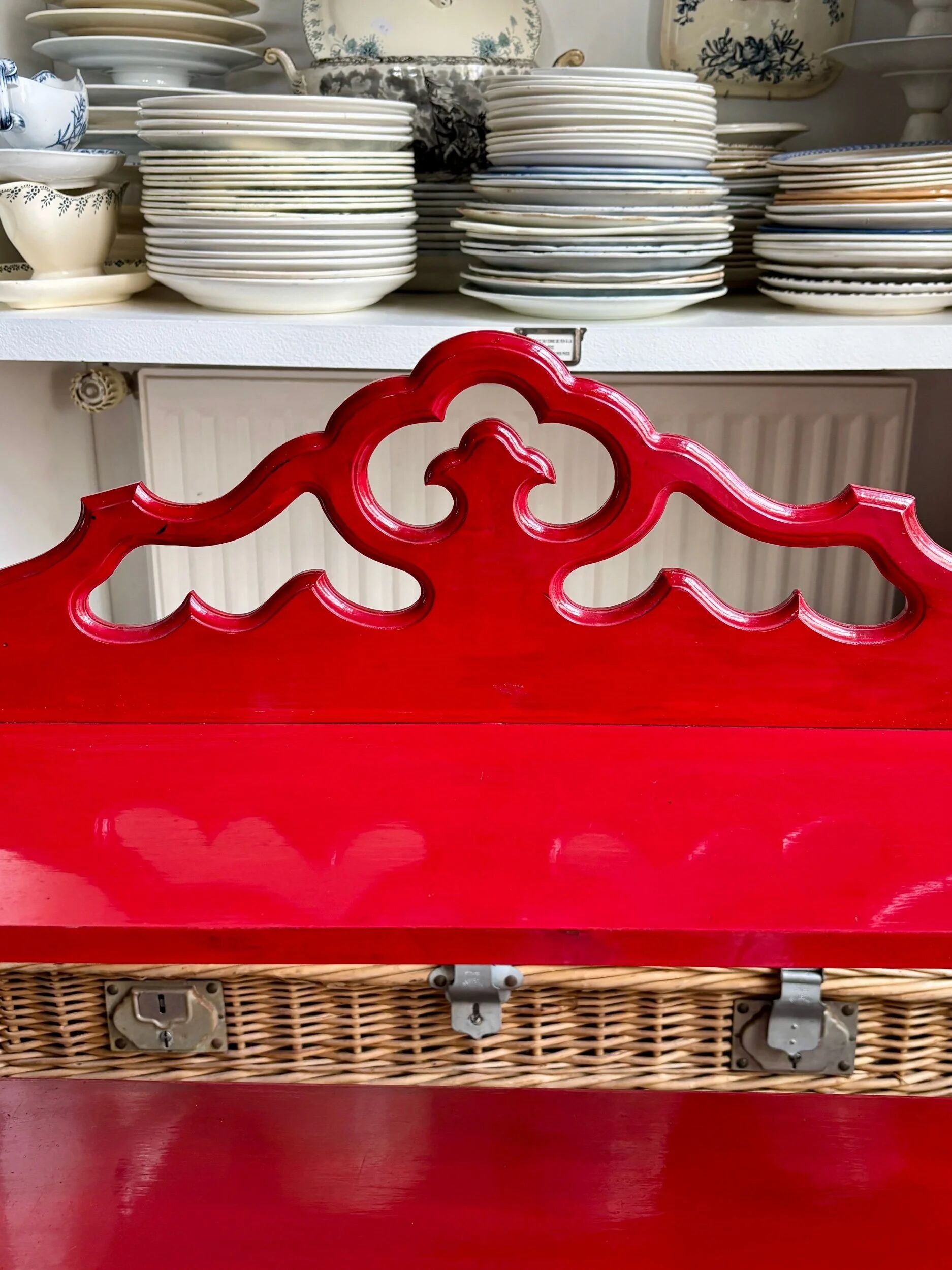 Wall shelf with 4 red lacquered wooden shelves.