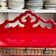 Wall shelf with 4 red lacquered wooden shelves.