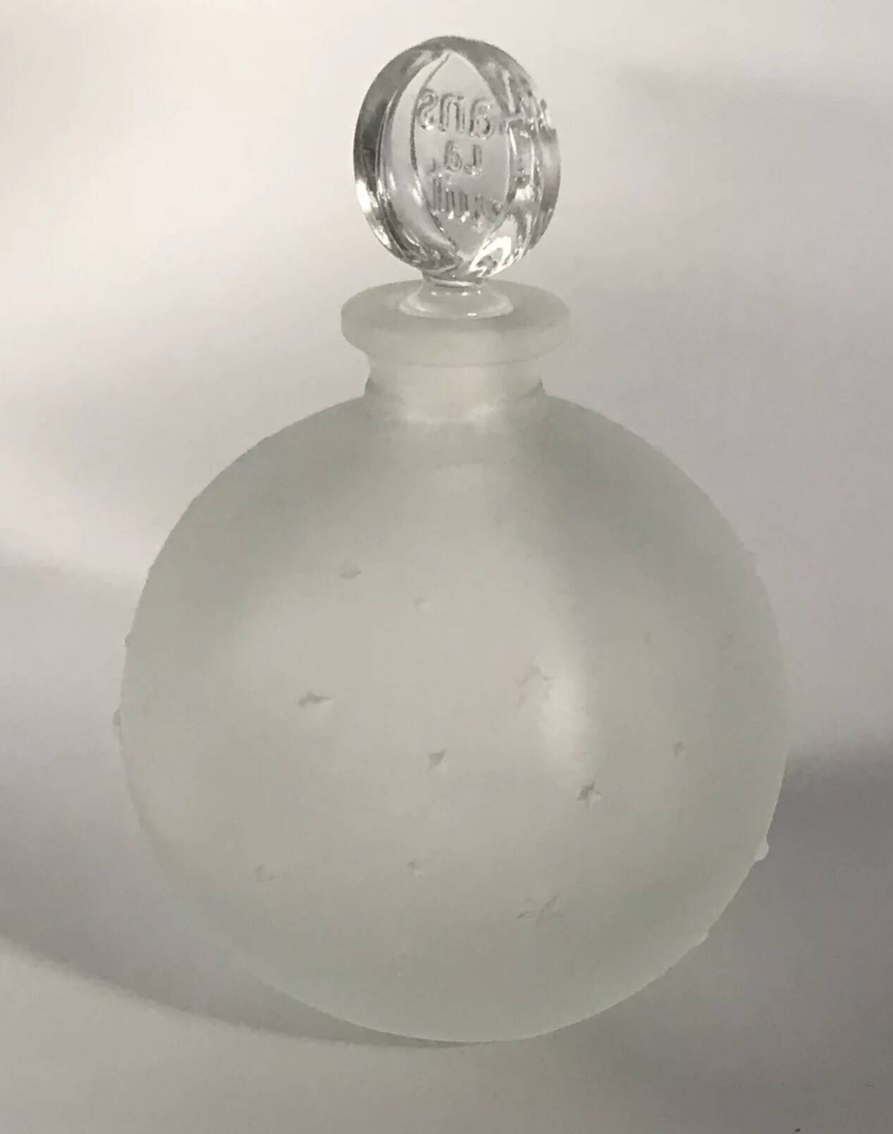 Lalique bottle in the night, frosted glass, ball shape