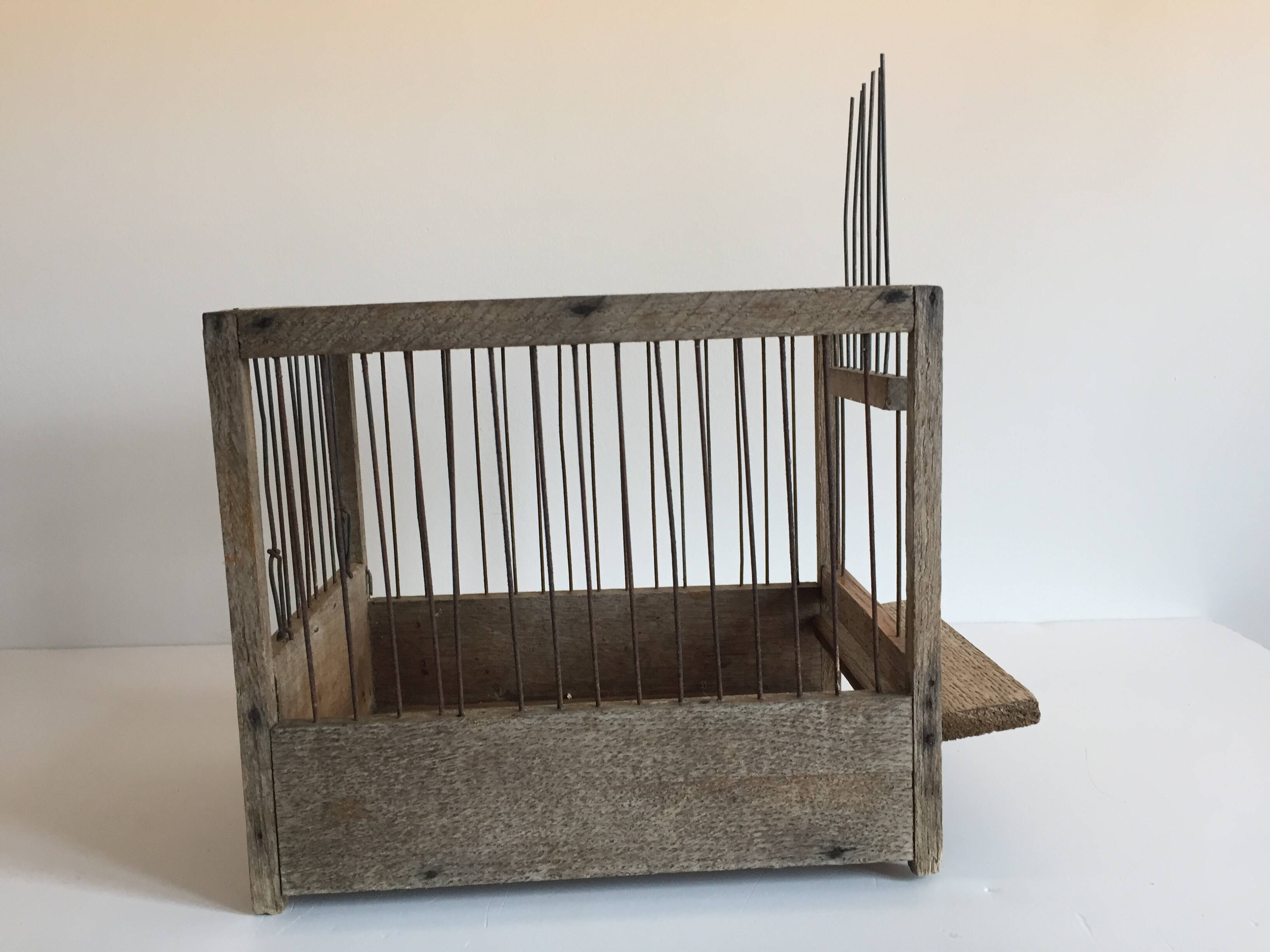 Old bird cage in wood and steel