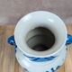 Blue and white Chinese vase with sculpted handles and landscape decoration.