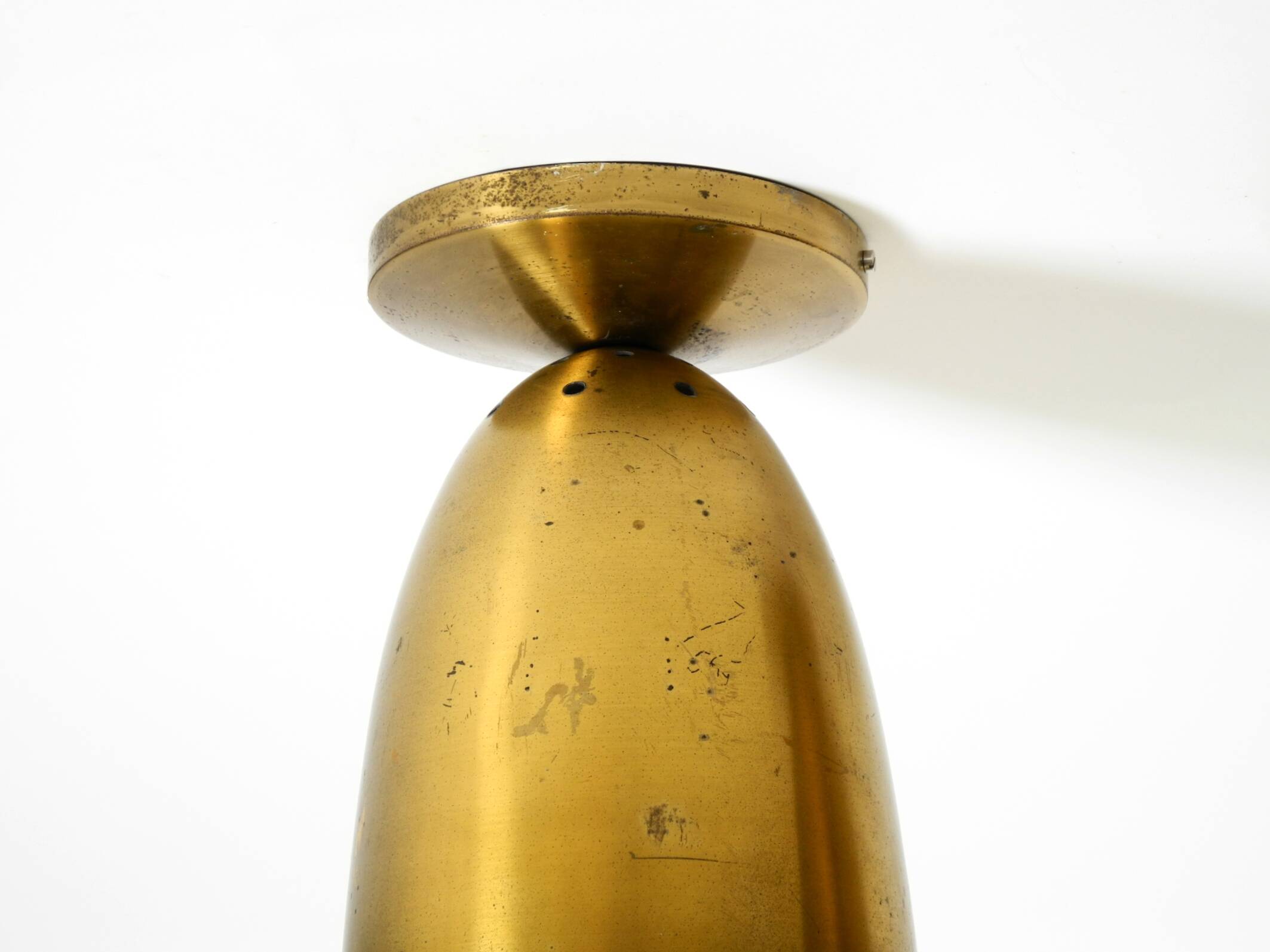 A pair of large, original Mid Century Modern brass ceiling lamps
