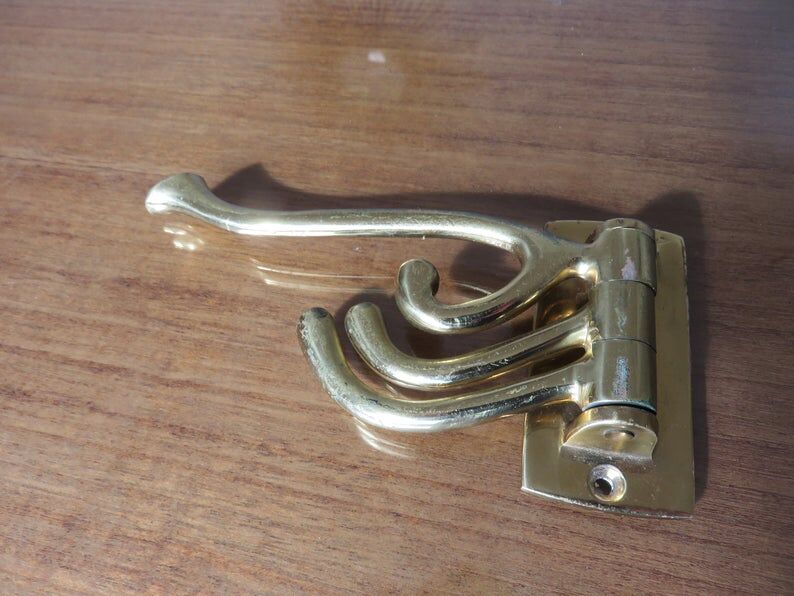 70s brass swivel coat door