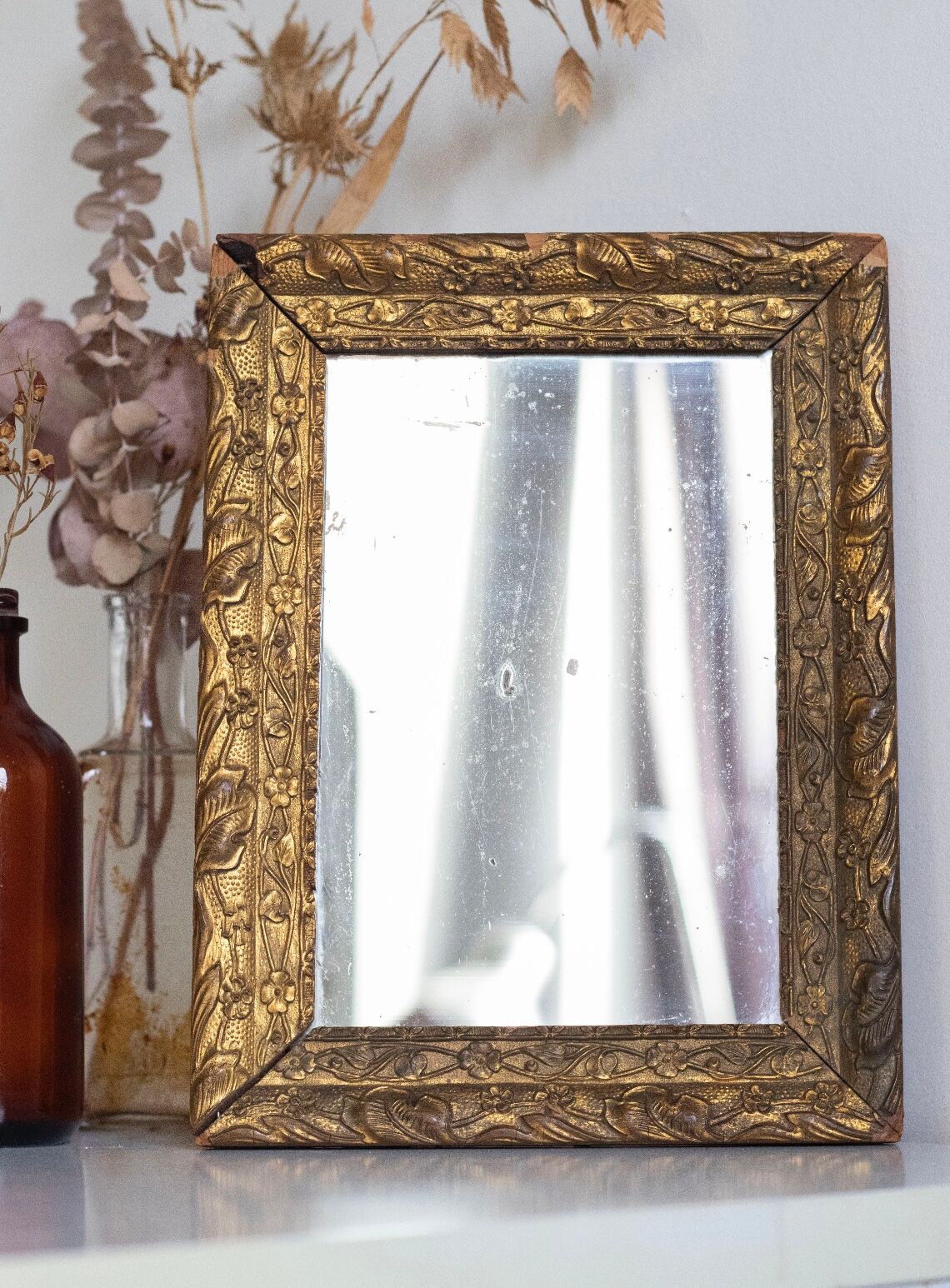 Antique mirror in gilded wood