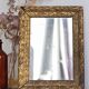 Antique mirror in gilded wood