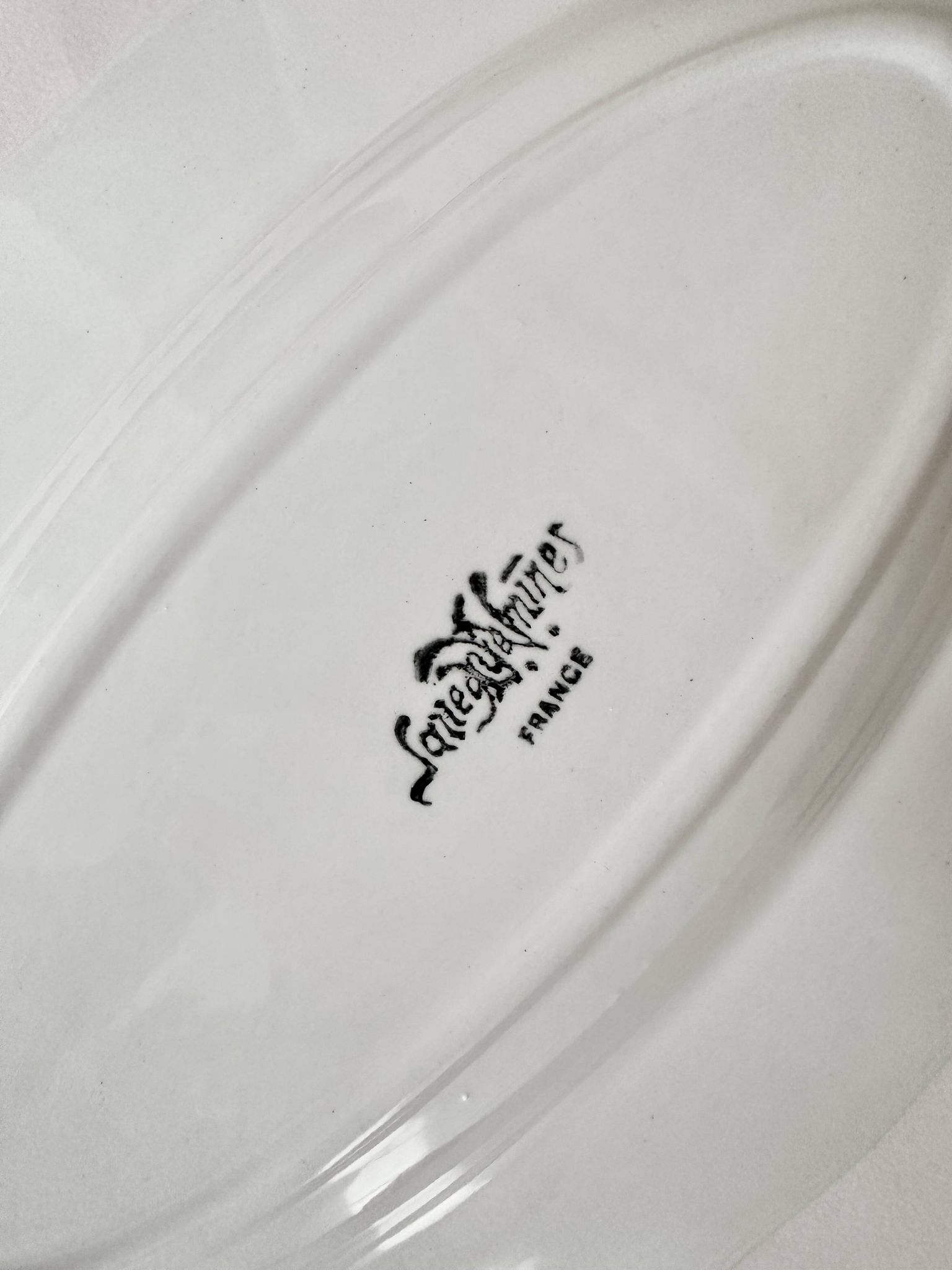 Shaped plates and dishes in Sarreguemines earthenware.