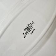 Shaped plates and dishes in Sarreguemines earthenware.