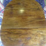 Nineteenth round table in carved mahogany with extension Ø 133 cm