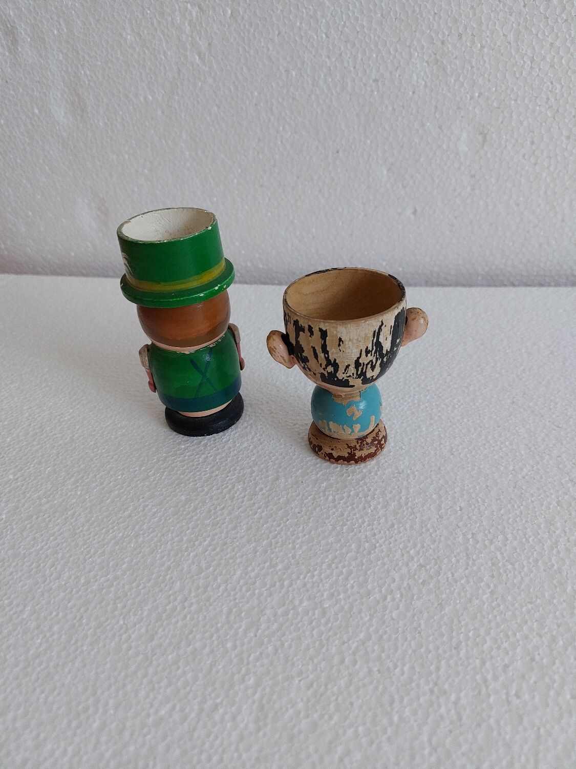 Duo of wooden cockroaches, characters