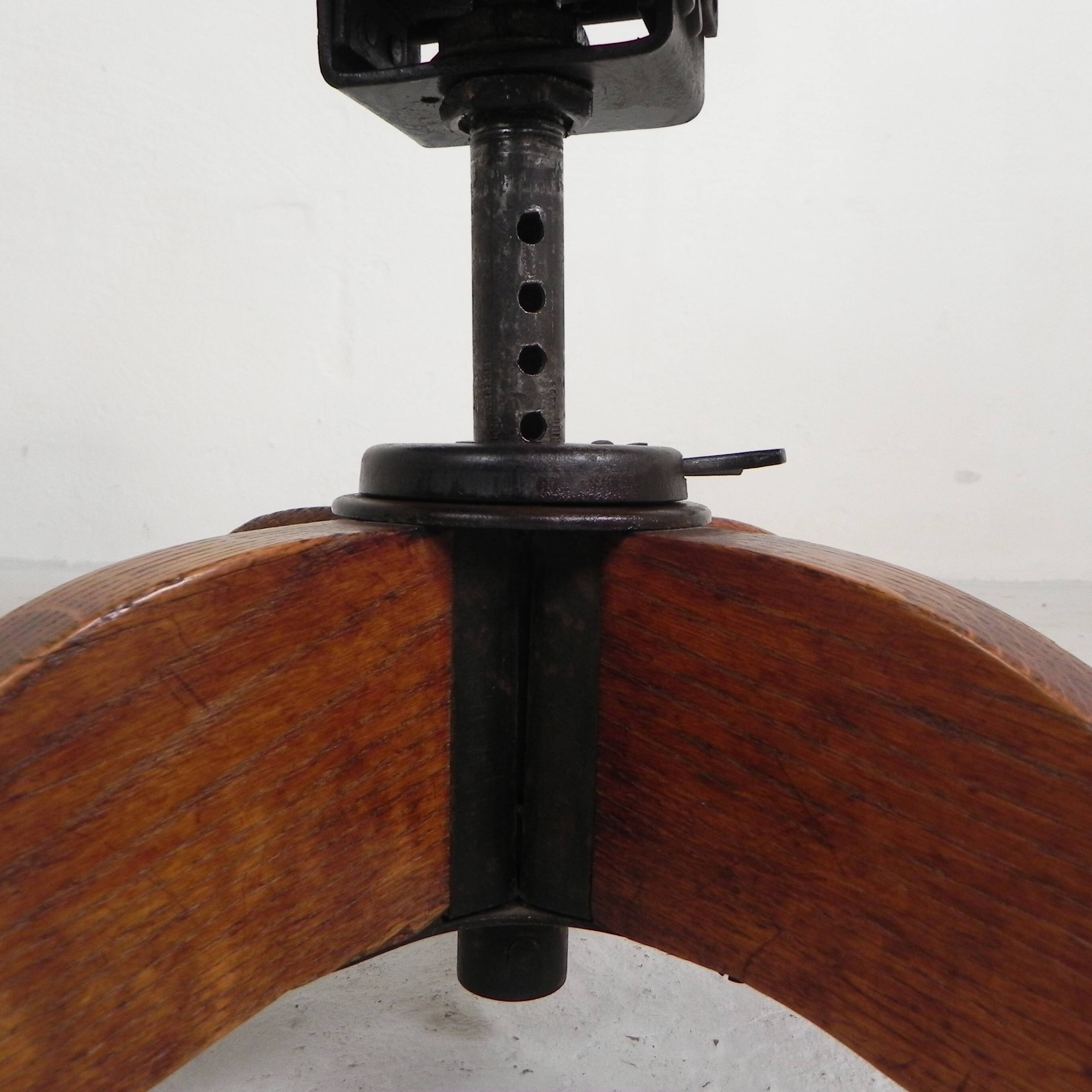 Oak office chair with a spring system and height adjustable, 1930s.