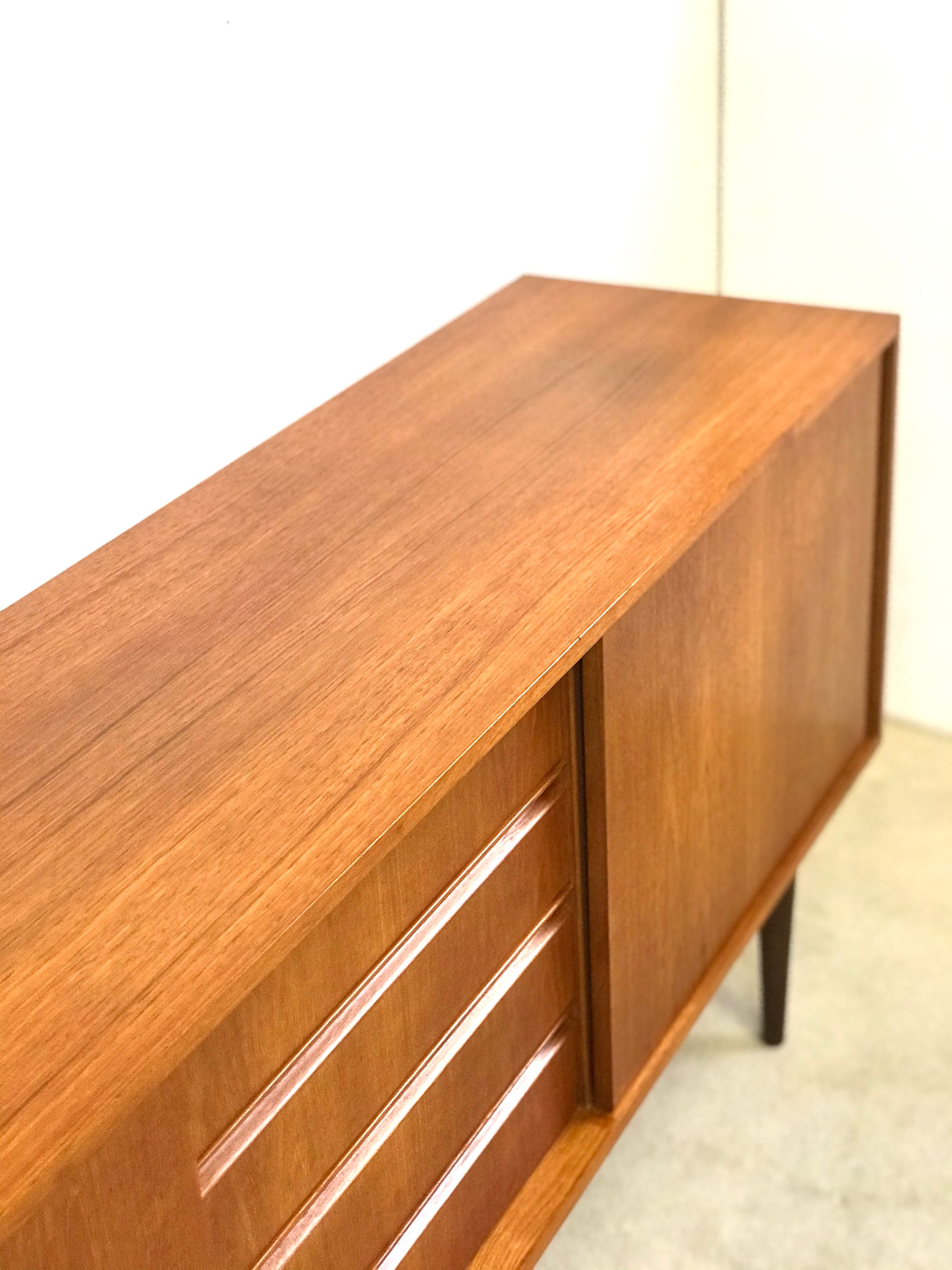 Danish teak sideboard with two sliding doors and 4 central drawers