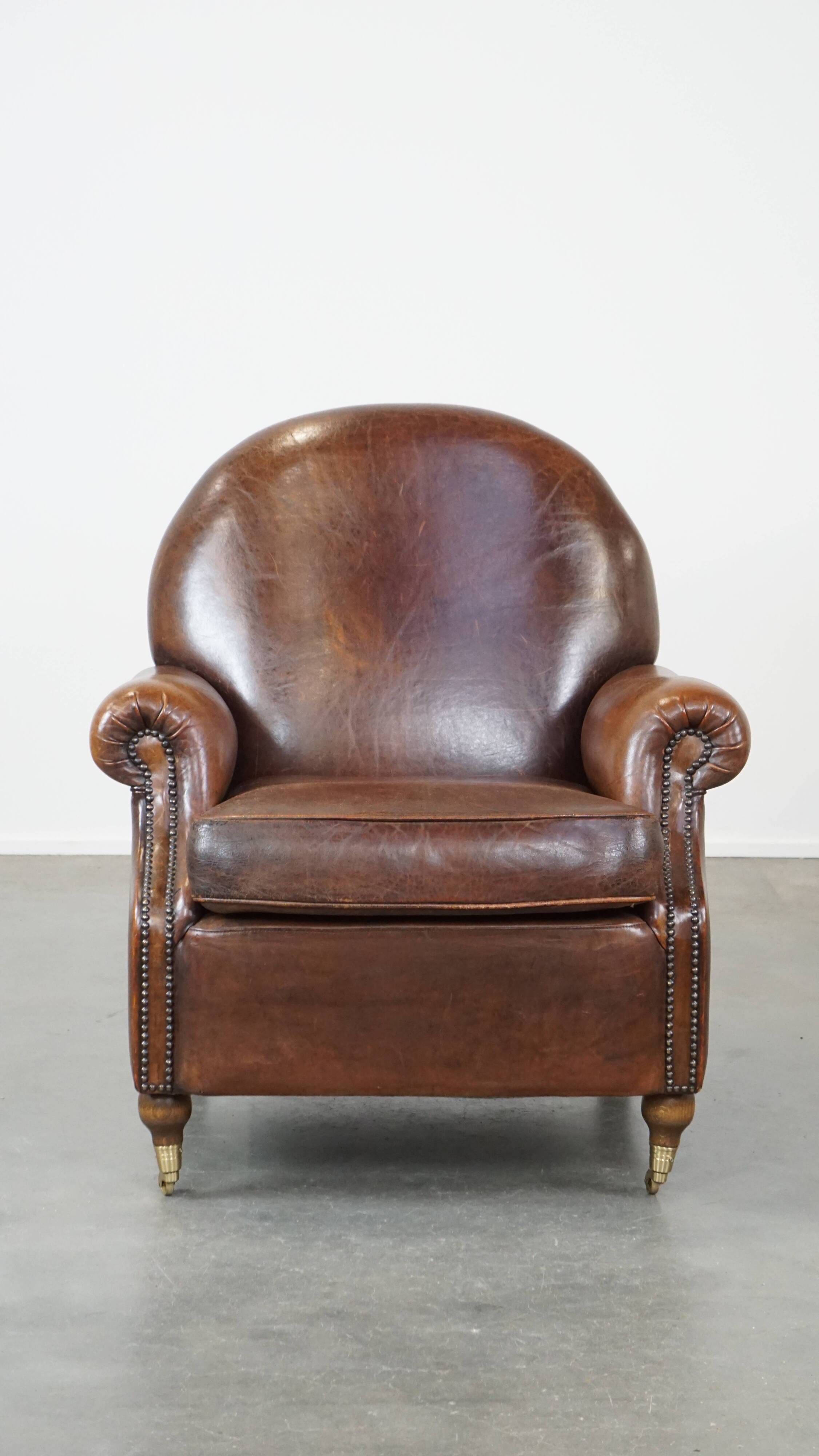 Sheep leather armchair on wheels