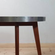 Vintage metal and teak side table from the 1950s.