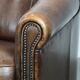 Set of two sheepskin club armchairs with fixed seat cushions