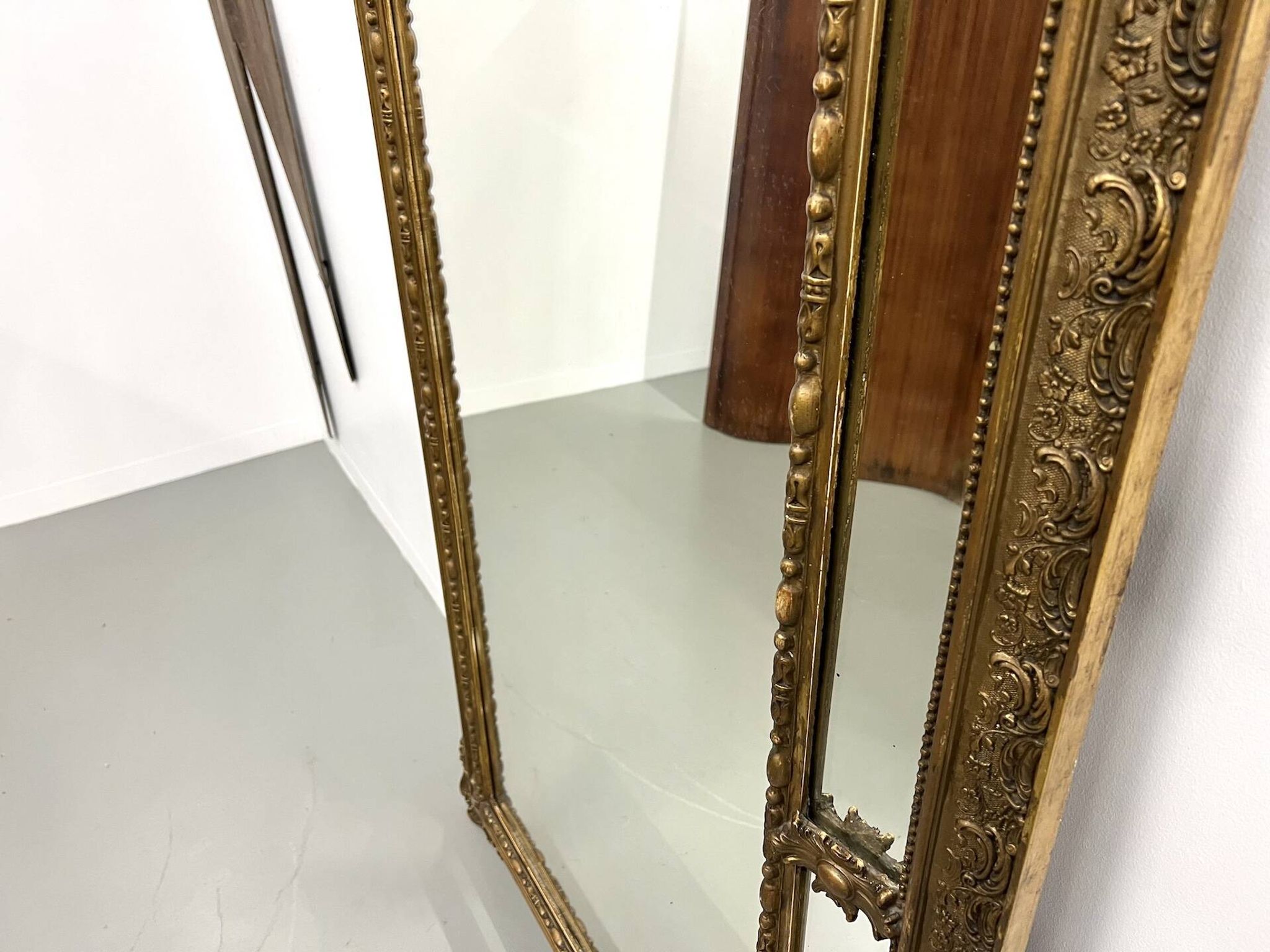 Large antique pediment mirror with mouldings.