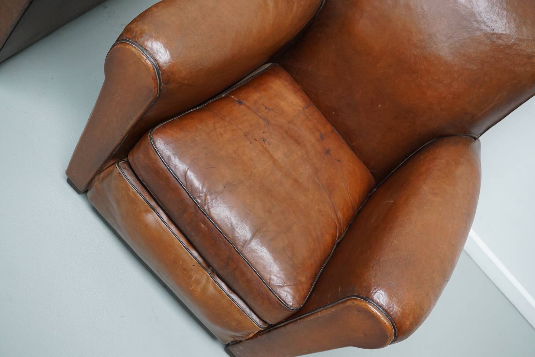 Pair of French Cognac Moustache Back Leather Club Chairs, 1940s
