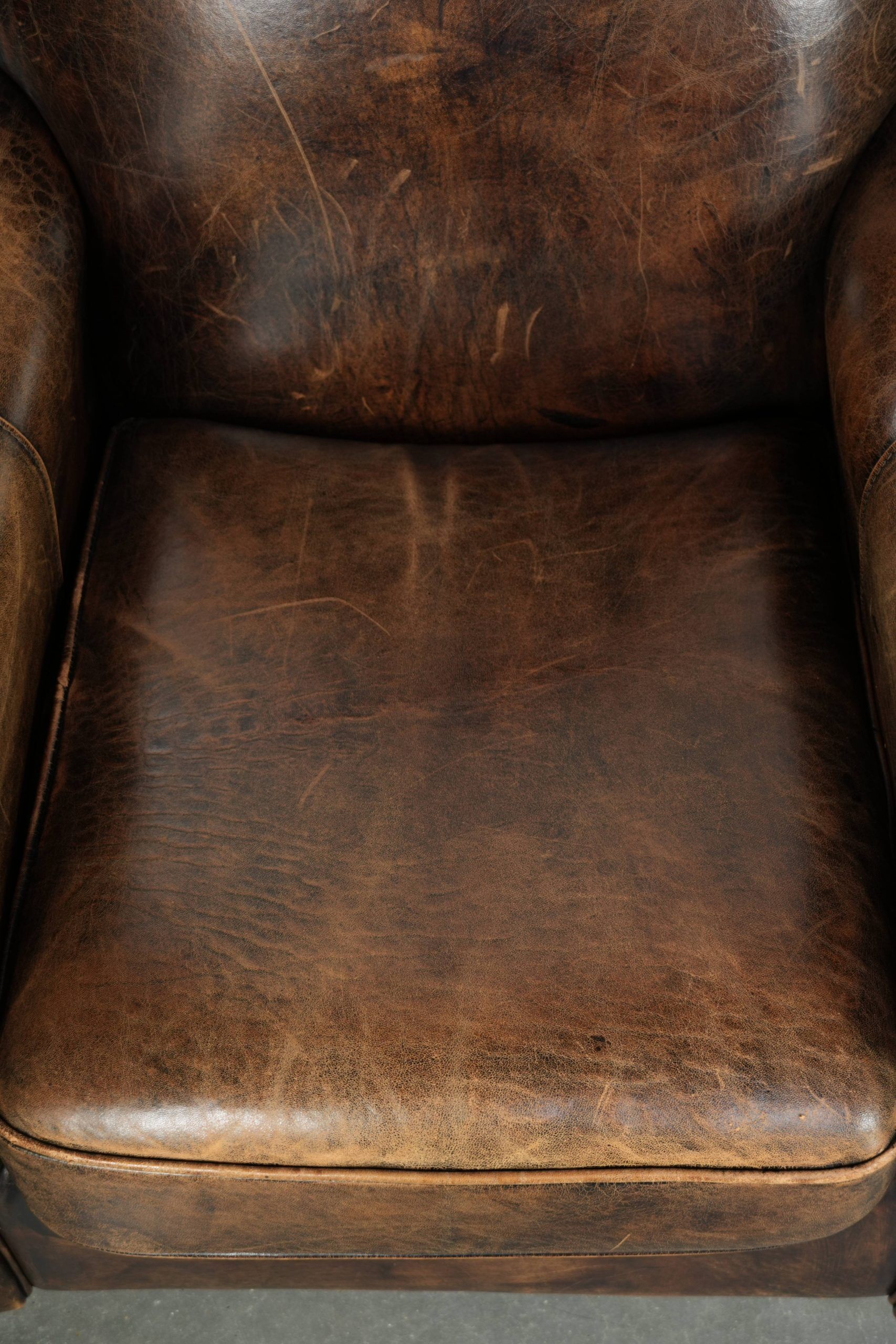 Set of two sheepskin Art Deco design armchairs with beautiful patina