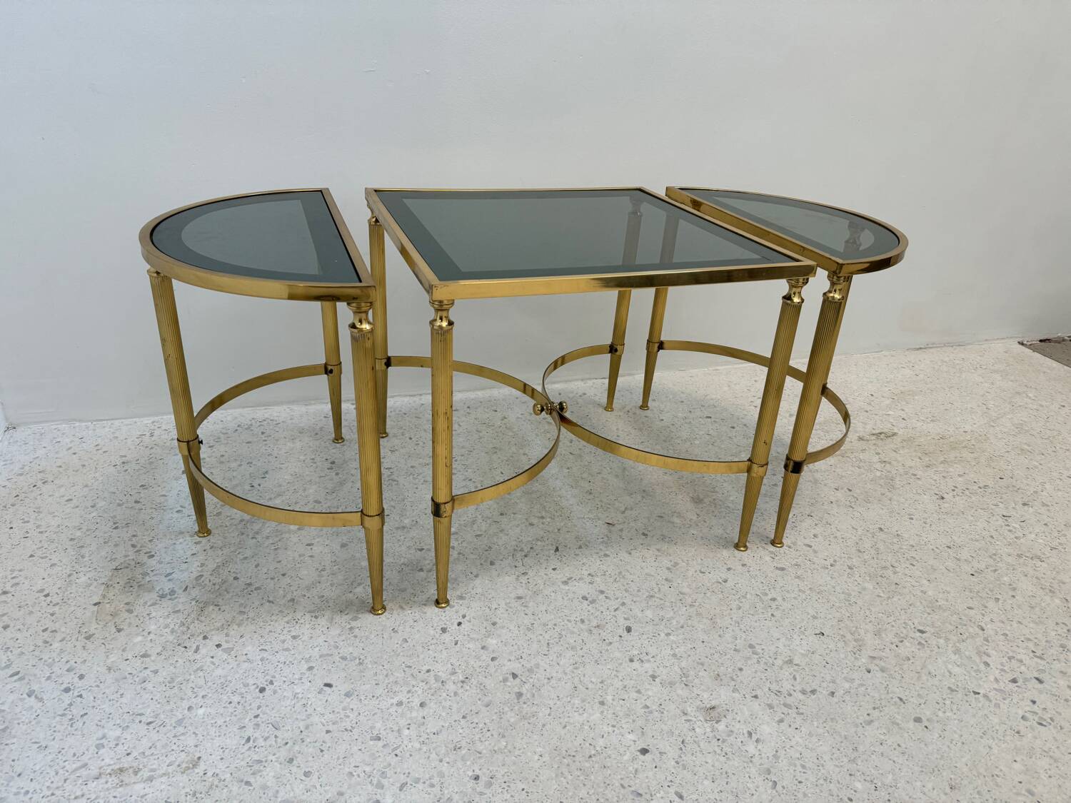 Neo classic coffee table in brass and smoked glass