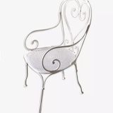 White openwork wrought iron armchair