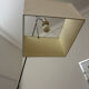Cinna floor lamp in wood, chrome, and fabric.