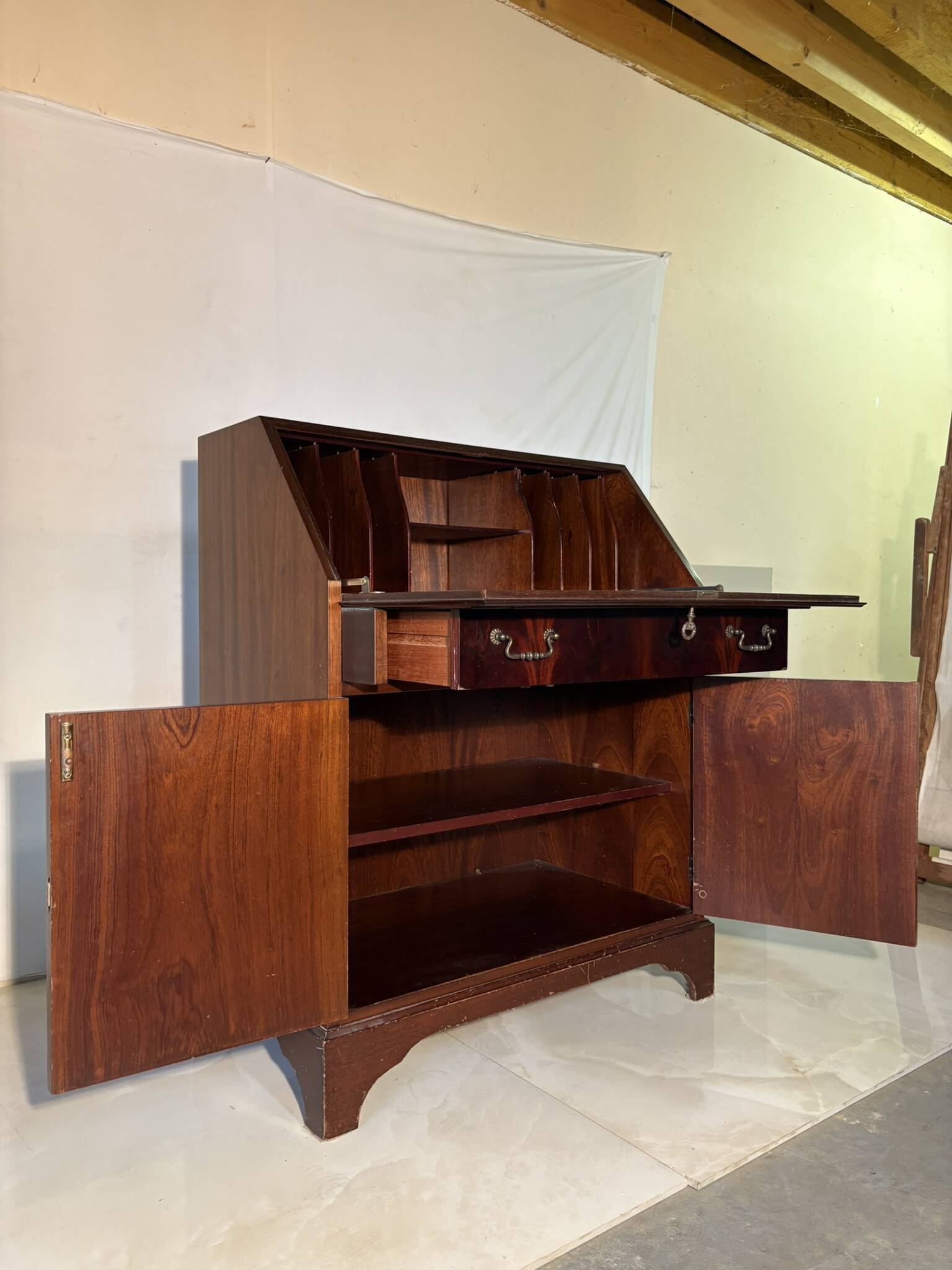 Antique mahogany secretary, upholstered flap and interior storage