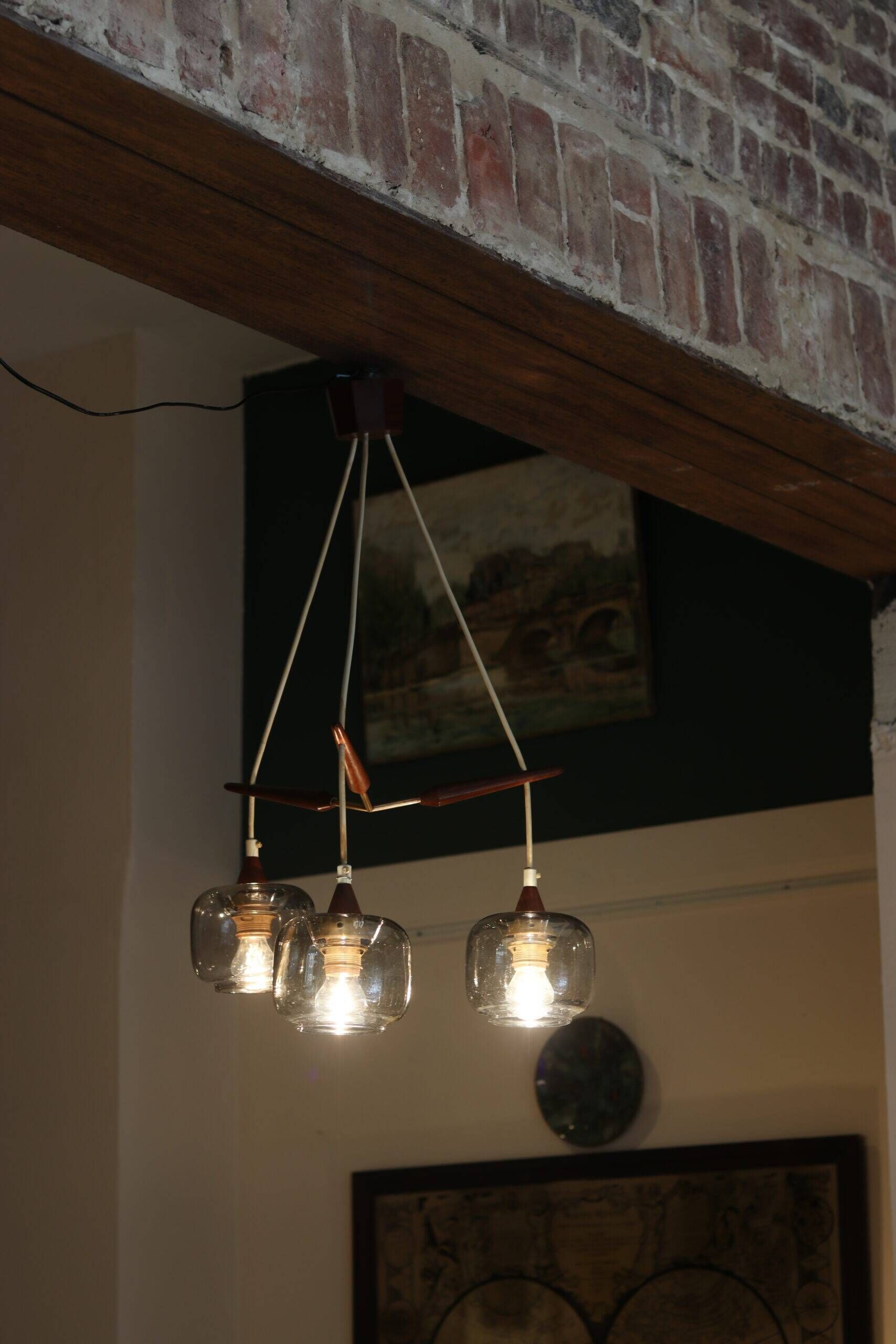 Scandinavian chandelier "Cascade" from the 1960s in brass, teak, and smoked glass.