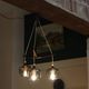 Scandinavian chandelier "Cascade" from the 1960s in brass, teak, and smoked glass.