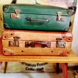 Green suitcase in vulcanized fibre