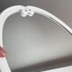 Vintage oval mirror in white enamelled cast iron