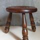Low tripod stool in vintage turned solid wood
