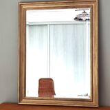 Large gold-framed mirror with bevelled glass.