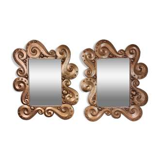 According to the model “the waves” by Jean Boggio: pair of designer gold mirrors circa 1980