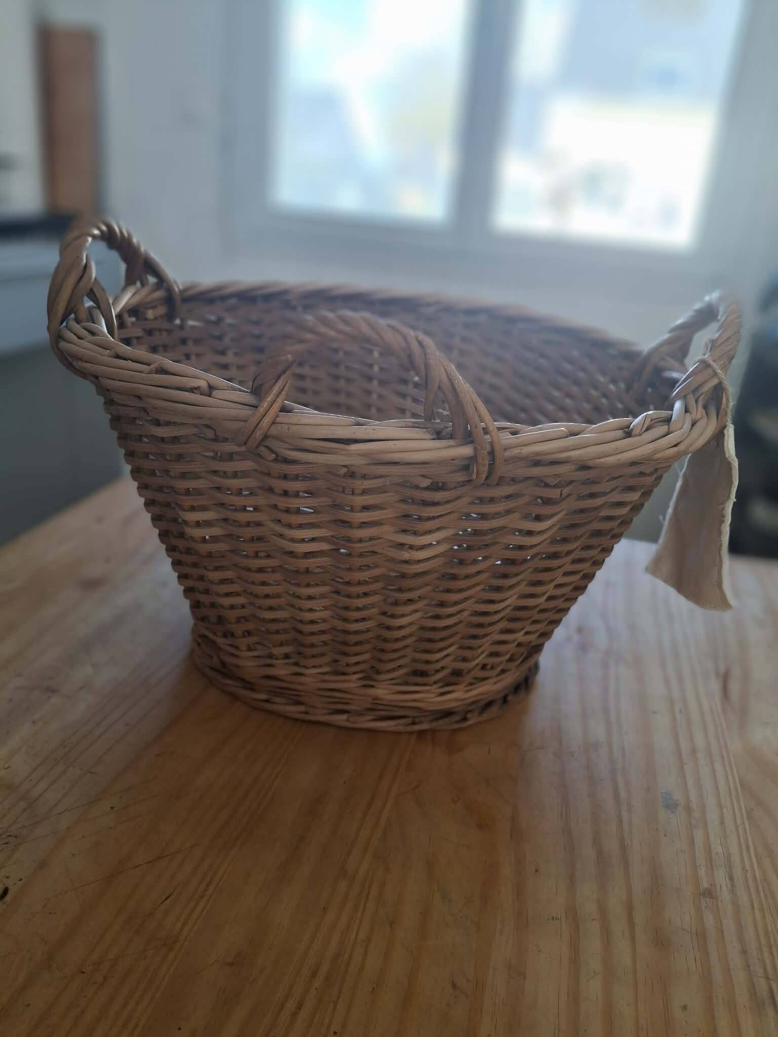 Old wicker basket with 3 handles.
