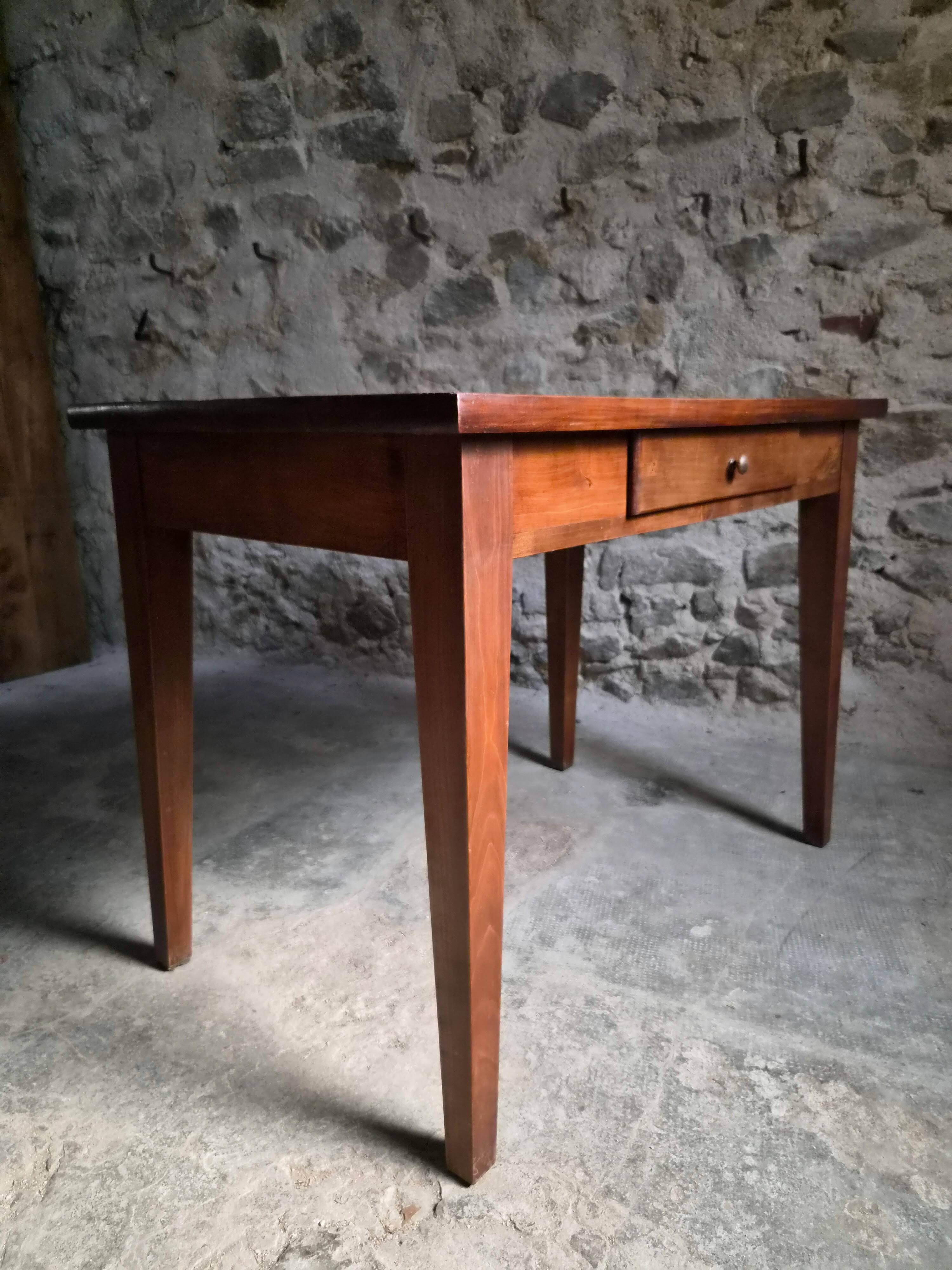 Old French table in cherry wood with bistro chair, circa 1900–1930.