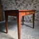 Old French table in cherry wood with bistro chair, circa 1900–1930.