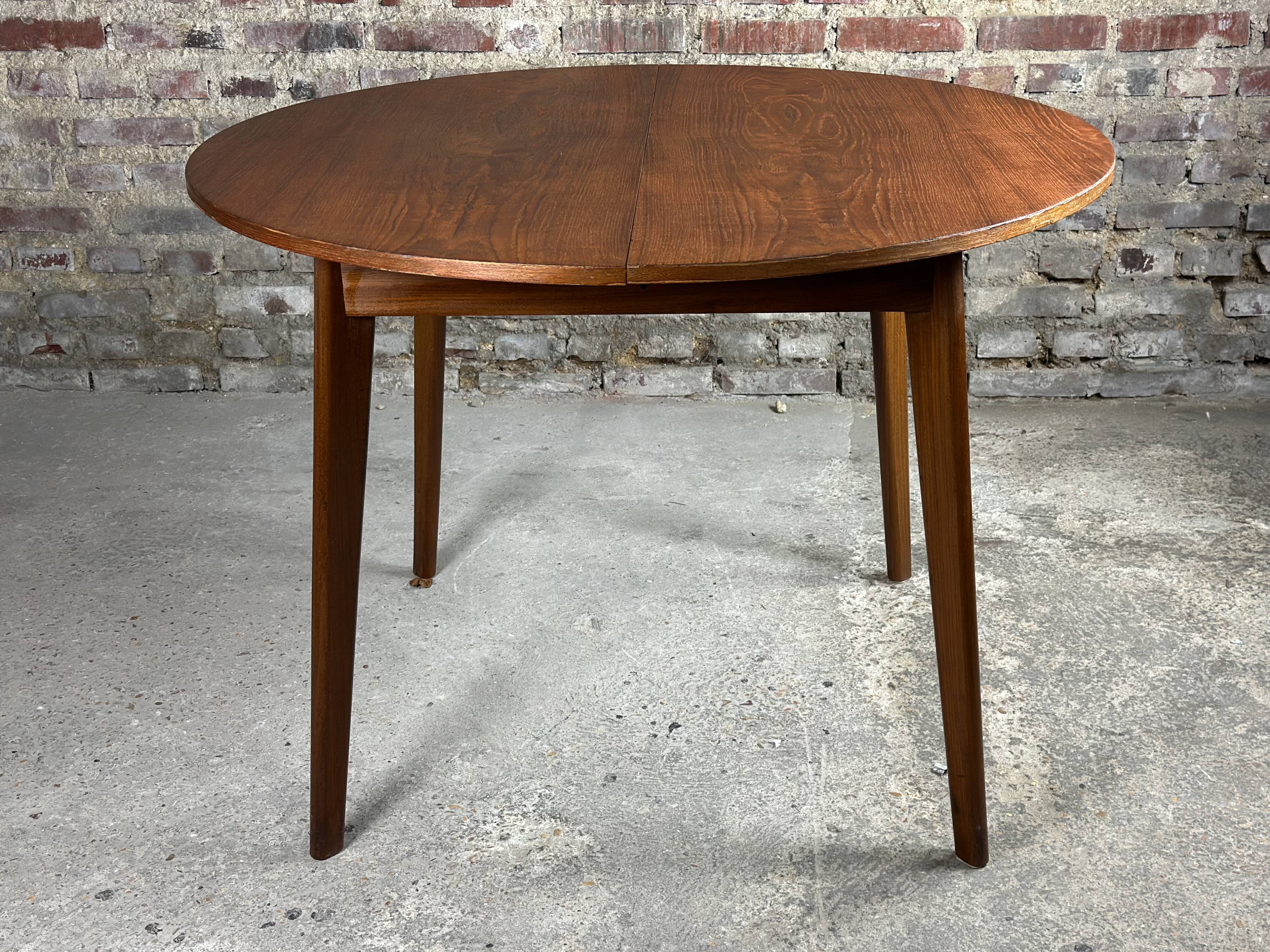 Scandinavian round teak table with integrated extension 70'S