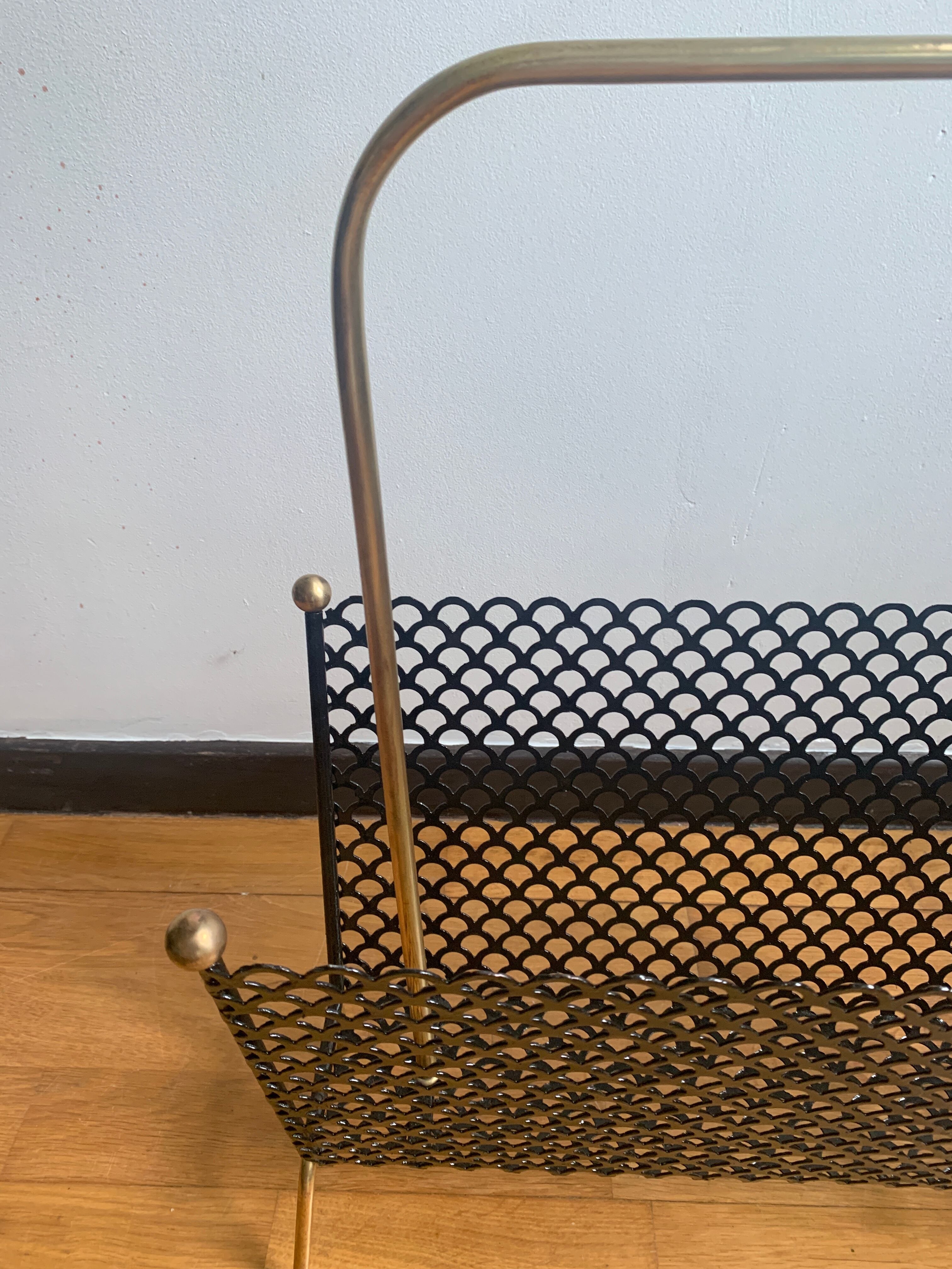 Perforated metal magazine door