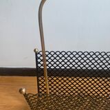 Perforated metal magazine door