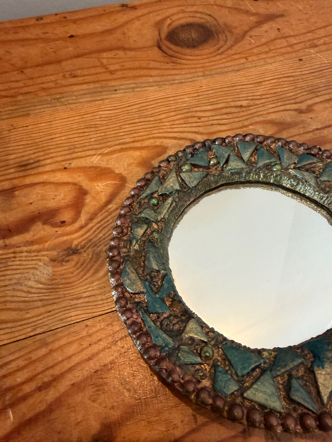Round mirror in gilded enamelled ceramic with inlay