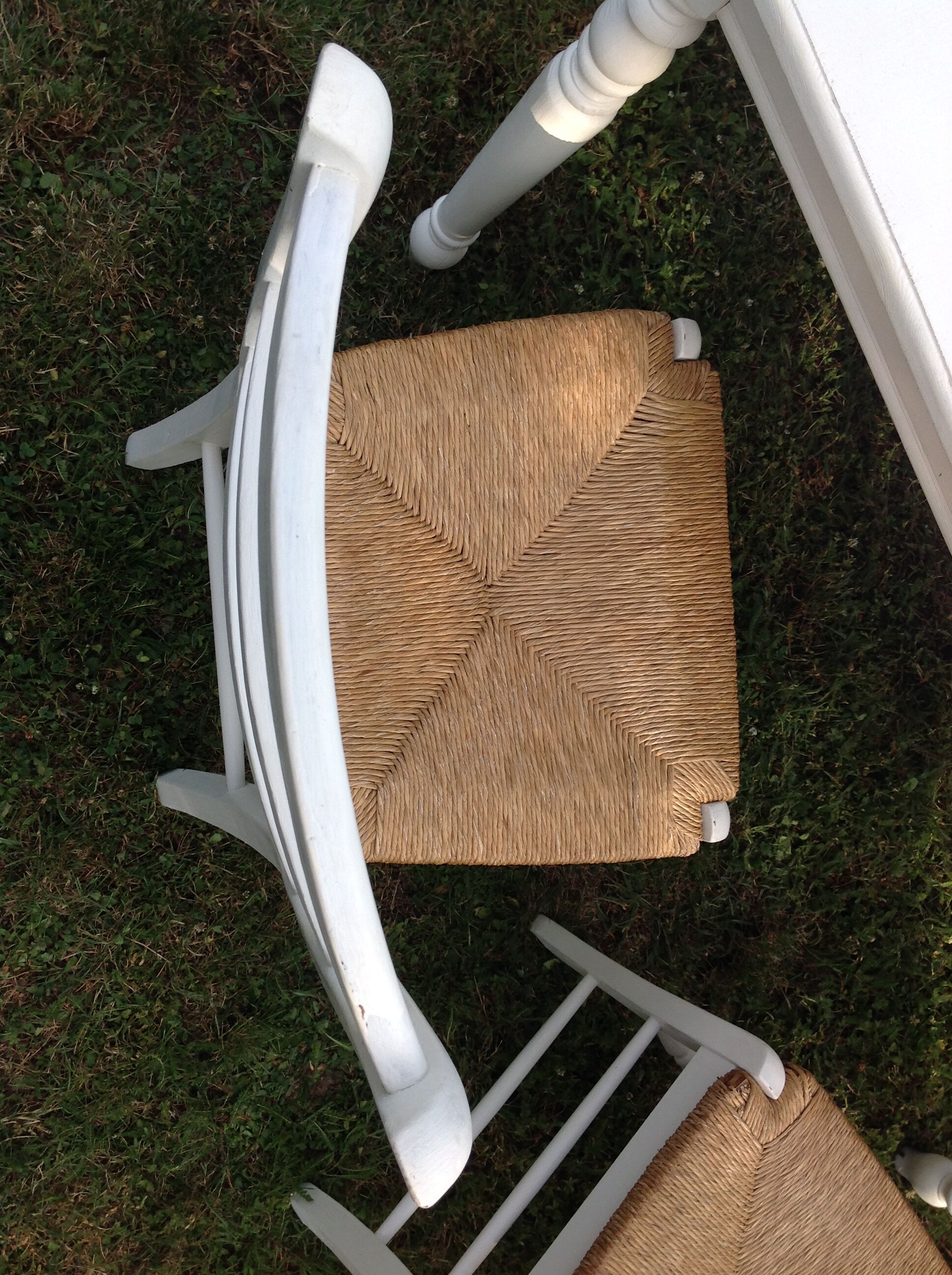 White farmhouse table set and four chairs