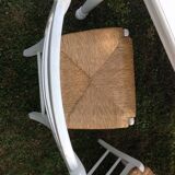 White farmhouse table set and four chairs
