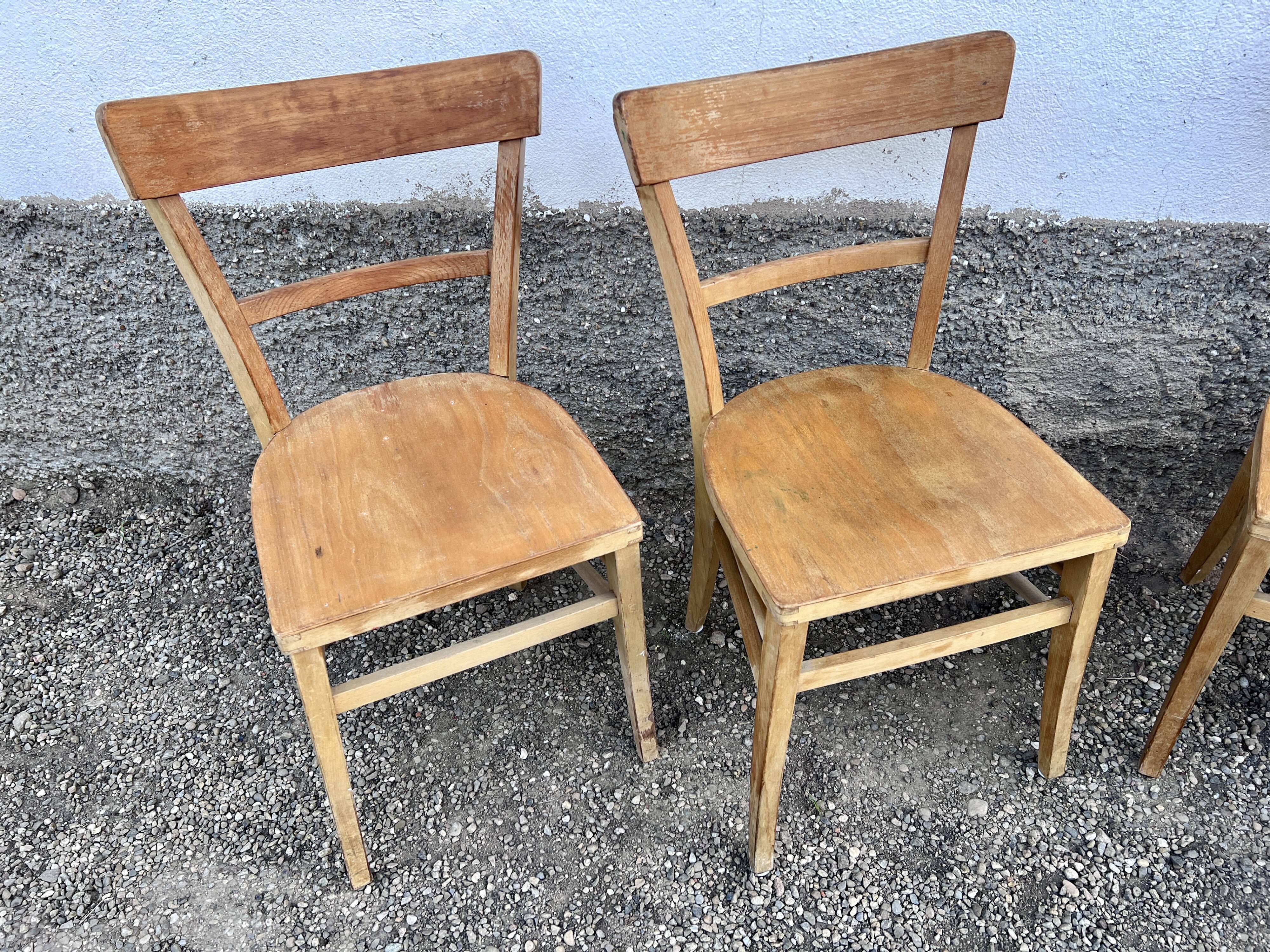 Series of 4 chairs in vintage light wood beech