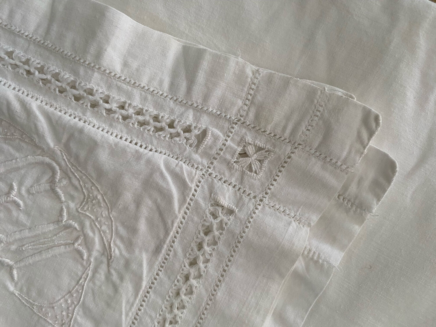White cotton pillowcase with embroidery and monogram from the 1960s.