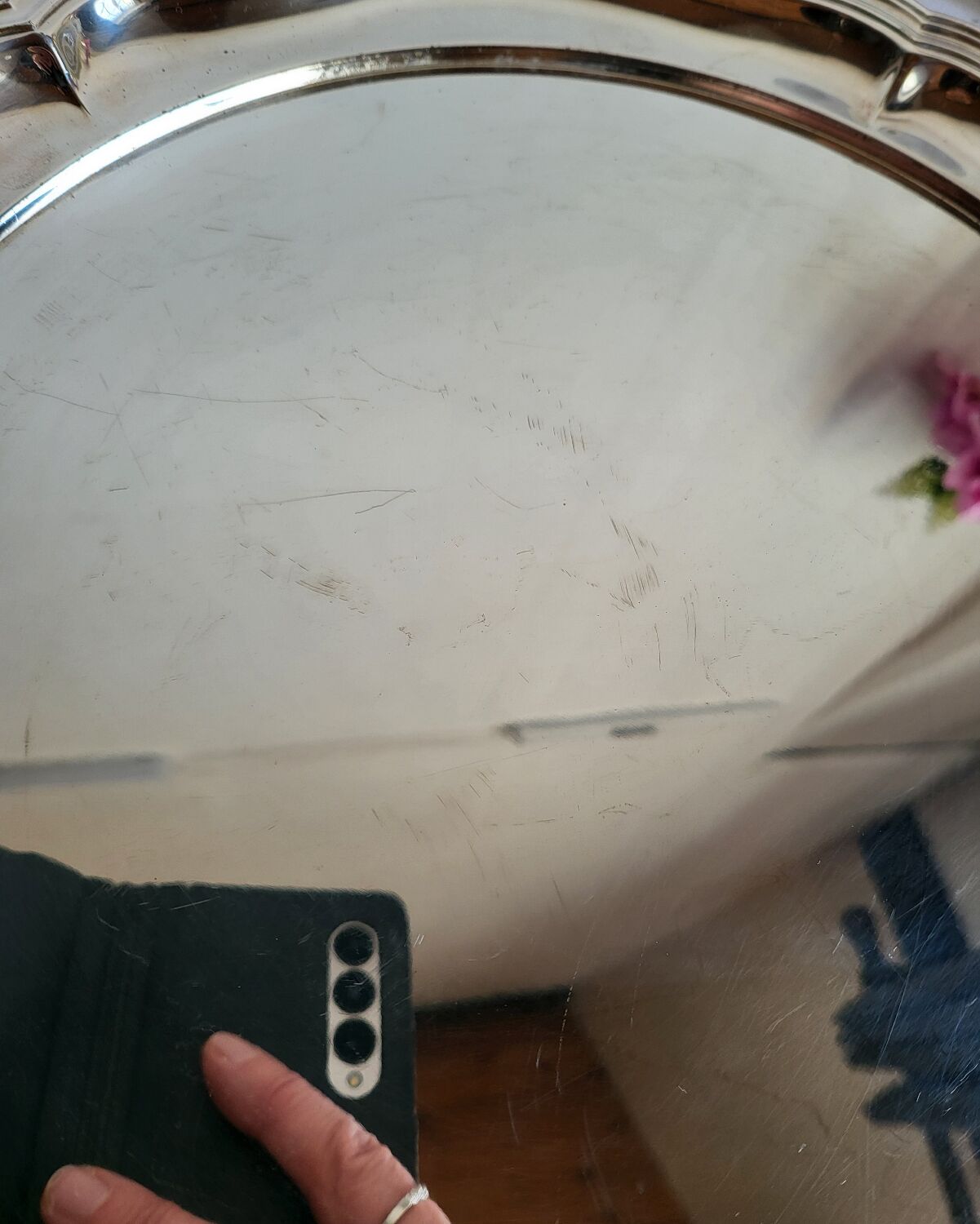 Round silver-plated serving dish with a glass base.