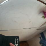 Round silver-plated serving dish with a glass base.