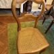 Light medallion chairs and carved fruit chairs.